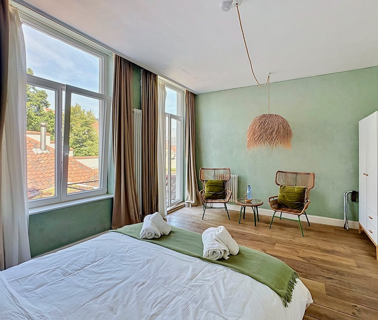 Terrace Room — windows and rattan armchairs